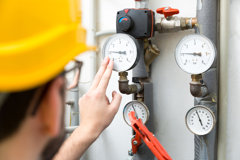 Maintenance,-,Technician,Checking,Pressure,Meters,For,House,Heating,System